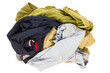 © SashaMagic - Pile of dirty laundry on a white background. Clothes for washing isolate on white.