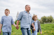 © Cavan - A father with his son and daughter on a walk.