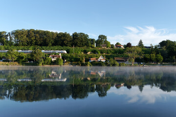 Wall Mural - Train to Paris and  Seine river bank near Seine-Port village in Ile-de-France region