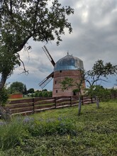 Old Windmill In The Countryside