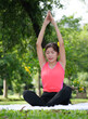 © Success Media - Asian woman doing exercise in park.