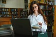 © Serhii - Beautiful girl in a library
