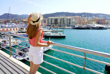 Enjoying Vacation In France. Young Traveling Woman Enjoying The Sight On Dock Of Lympia Port In Nice, France.