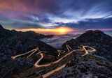 Fototapeta Nowy Jork - Long exposure of spectacular hair pin road with light trails on Mallorca, Spain at sunset