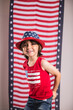 © Tamara Sales  - child wearing 4th of july clothes and hat celebrating studio photo copy space