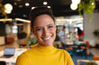 © Wavebreak Media - Portrait of smiling young biracial businesswoman in creative office
