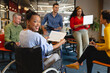 © Wavebreak Media - Portrait of smiling african american businesswoman with disability in meeting at office