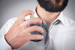 © andranik123 - Caucasian elegant man spraying perfume.