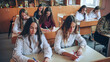 © Довидович Михаил - Pupils of the 11th grade in the class at the desks during the lesson. Russian school.