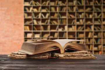 Wall Mural - Old books on table in library