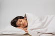 © IndiaPix - Portrait of a cute boy sleeping on bed