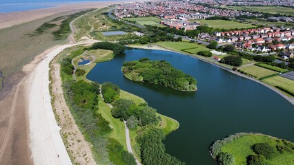 Canvas Print - Aerial view of Fairhaven lake in Lytham St Annes with views of the coast in the background. 