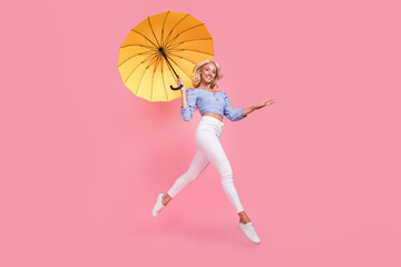 Sticker - Full length photo of charming shiny lady wear off shoulders top jumping flying umbrella walking isolated pink color background