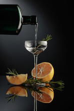 Gin With Lemon And Rosemary On A Black Background.