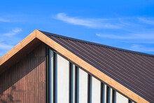 Wooden Gable Roof With Battens Decoration Of Vintage House Against Cloud On Blue Sky Background