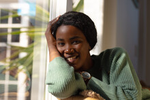 Portrait Of Confident Smiling Young African American Woman At Home, Copy Space
