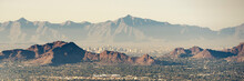 Phoenix Skyline Through Camelback Mountain And Pollution.