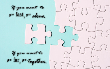 Wall Mural - Motivational quote and white jigsaw puzzle with some missing pieces.