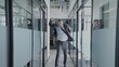 © Synthex - Excited businessman running in office corridor, jumping, happy with successful deal