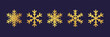 Golden snowflake. Icon of a snow flake made of a golden foil