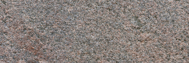 Wall Mural - Granite texture. Natural pink granite with a grainy pattern. Stone background. Solid rough surface of rock. Durable construction and decoration material. Close-up.