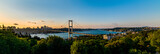 ISTANBUL, TURKEY. Panoramic view of Istanbul Bosphorus on sunset. Istanbul Bosphorus Bridge (15 July Martyrs Bridge. Turkish: 15 Temmuz Sehitler Koprusu). Beautiful cloudy blue sky.