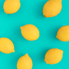 Wall Mural - Creative summer pattern made of lemons on bright blue background. Fruit minimal concept.