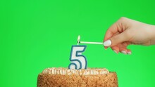 Cake With Lighted Candle Number 5. Green Screen Background. Isolated.