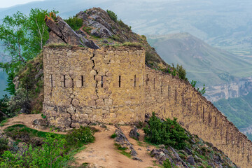 Wall Mural - ancient tower on top of a sheer cliff in a mountainous area, Gunib (Shamil) fortress in Dagestan