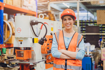 Portrait young teen Asian woman machine engineer working in heavy industry happy smiling confident.