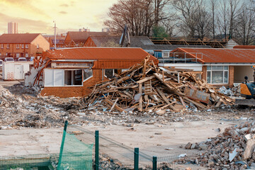 Wall Mural - Ruins of a demolished building. Dismantling an old building. Pile of rubble at demolishing site