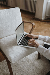 Wall Mural - person using laptop computer. freelancer home office desk workspace. online shop, store, blog concep