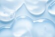 © tatyanarow - Cosmetic blue gray lotion transparent gel drops texture background