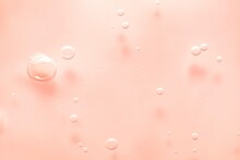 Cosmetic Pink Lotion Transparent Gel Drops Texture Background