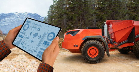 Aufkleber - Engineer programs autonomous mining truck using digital tablet