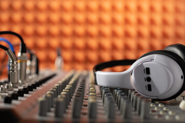 Headphones and sound mixer radio station. Music concept sound record studio