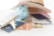 Save Money For Airplane Tickets, Planning Travel Budget Concept. Airplane Model, Piggy Bank On Wooden Table