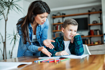 Wall Mural - homework teaching education mother children son familiy childhood child teacher bored tired sad