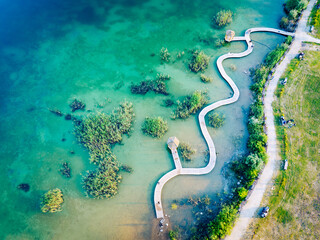 Canvas Print - Turquiose Water and Wooden Bridge. Aerial Landscape. Park Grodek in Jaworzno, Poland. Polish Maldives.