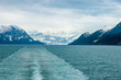 Ship sailing away from the famous Hubbard Glacier as it enters the ocean on the Alaskan coast south of Valdez