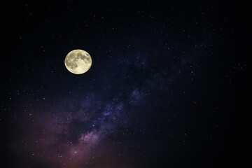 Wall Mural - big moon on night blue starry sky dramatic clouds nebula and milky way universe space