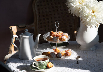 tea break in english style, vintage still life, homemade buns, a bouquet dalias