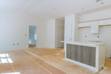 Wall Mural - Installed white kitchen wooden cabinets with a view of home improvement in a set of furniture being constructed