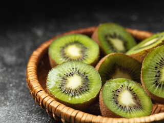 Canvas Print - Sliced kiwi in a colander