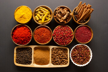 Wall Mural - various spices on black background