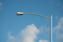 Street Lamp Post With Blue Sky And White Clouds