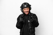 © luismolinero - Middle age SWAT man isolated on white background pointing to the front and smiling