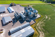 © hiv360 - aerial view on agro silos granary elevator on agro-processing manufacturing plant for processing drying cleaning and storage of agricultural products, flour, cereals and grain.