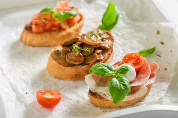 Wall Mural - Tasty mix of bruschetta with fresh ingredients for breakfast.