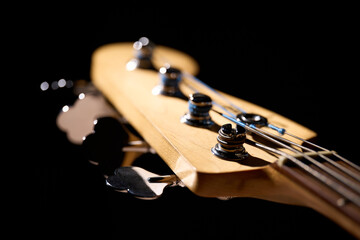 Metallic volume treble guitar bass knobs. Electric guitar. Red electric bass guitar close-up. Musical instrument. Music. Four strings. Grif.